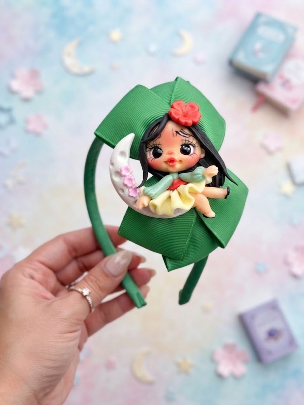 Custom clay bow 
Green Kids Headband with Cute Doll Accent